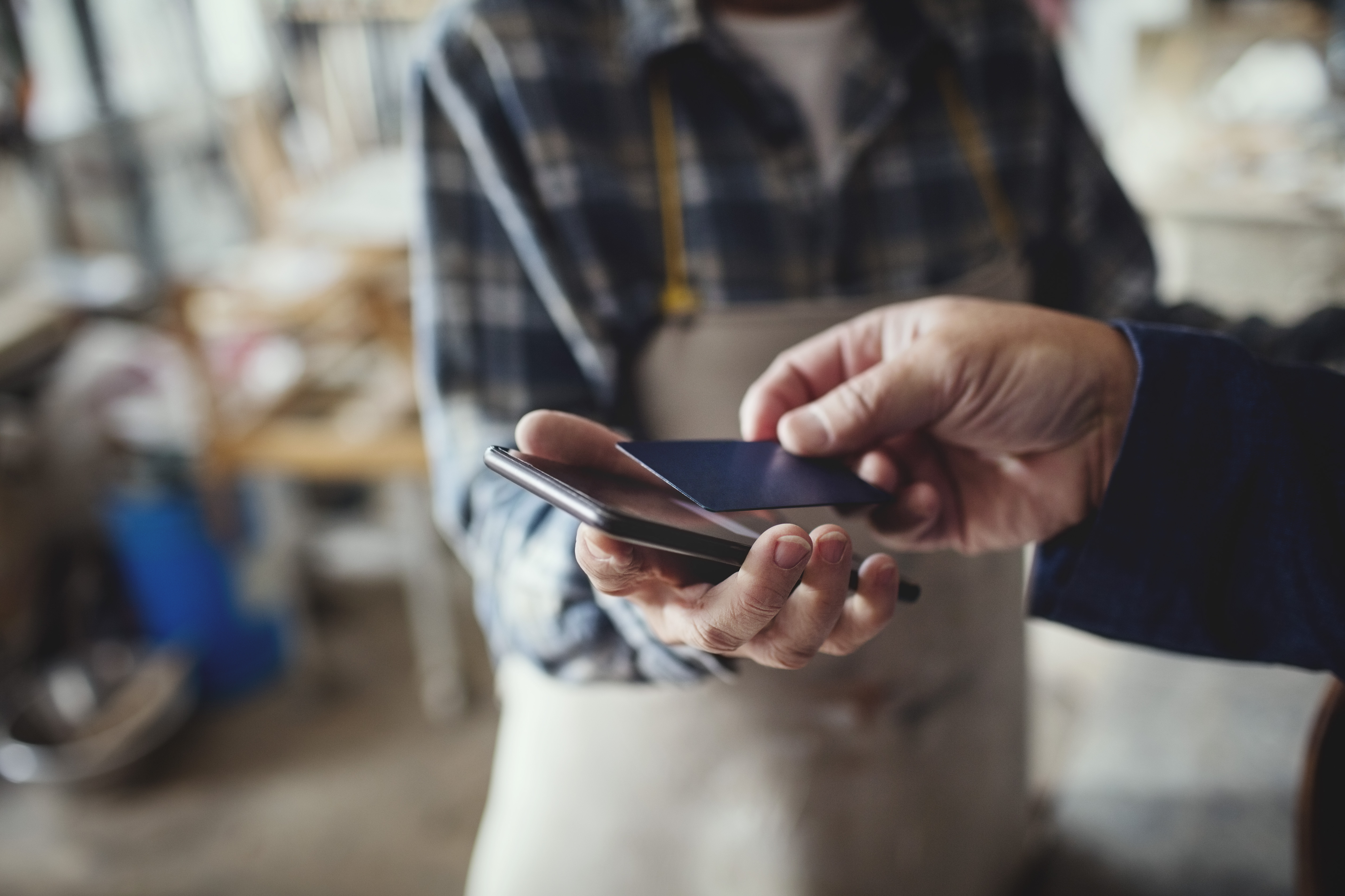 person tapping to pay on a mobile device